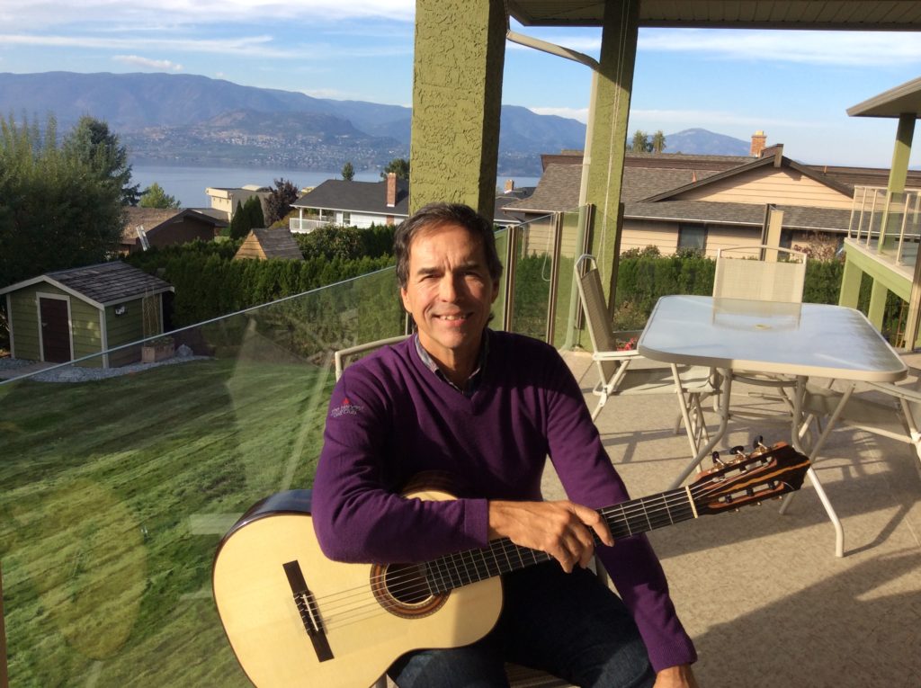 Article author Alan Rinehart holding guitar