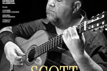 Scott Tennant playing a classical guitar with his eyes closed on the cover of Issue 384 of Classical Guitar magazine