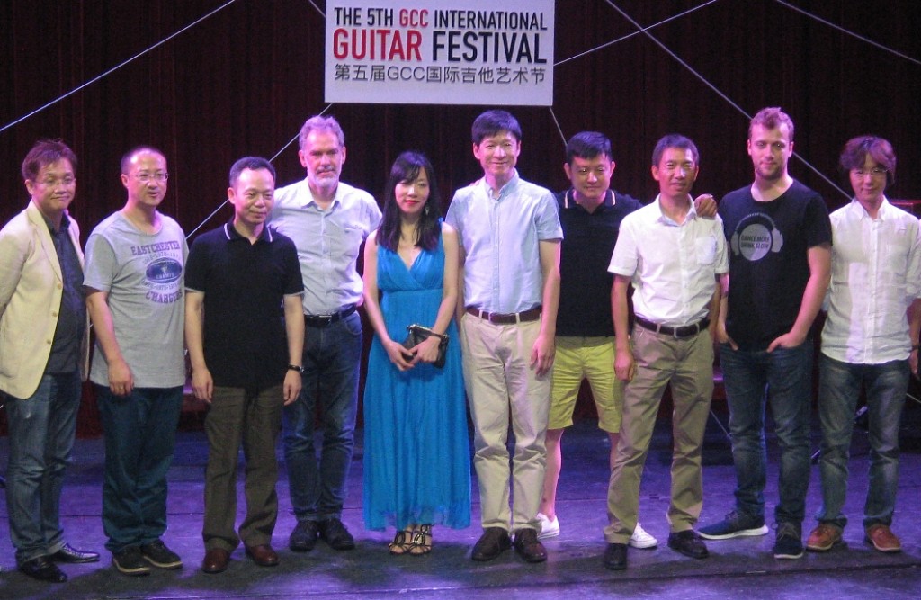 Artistic director Xuefei Yang (center) with various players and judges
