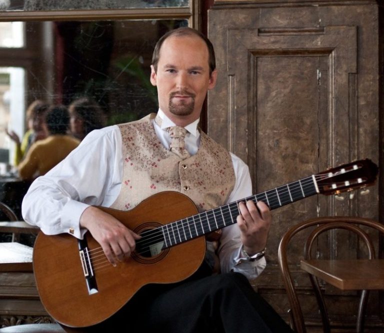 Classical guitarist Jan Depreter holding guitar